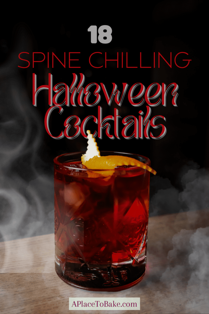 Text that reads "18 Spine Chilling Halloween Cocktails" above a red cocktail in a whiskey glass on a table surrounded by misty fog.