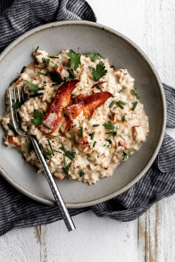 risotto topped with pieces of lobster