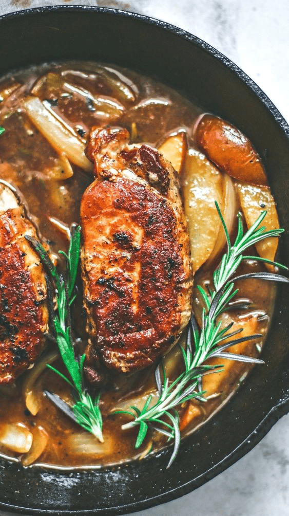 pork and rosemary in a cast iron skillet 