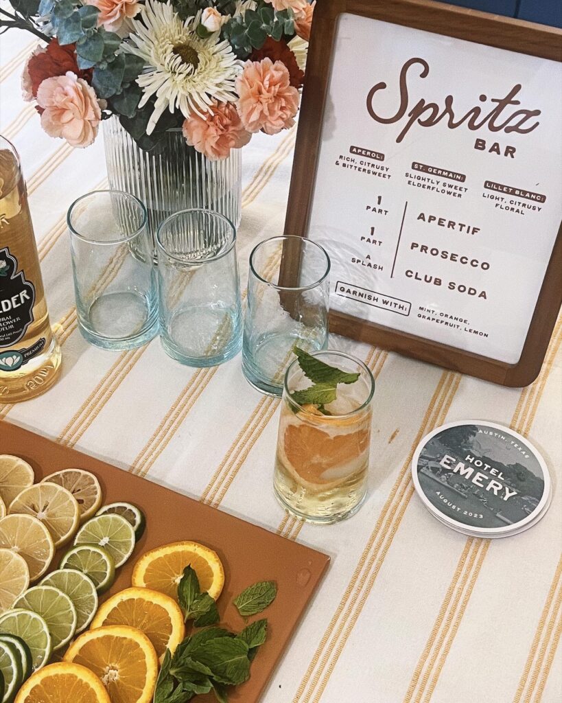 spritz cocktail bar with menu, glasses, and garnishes